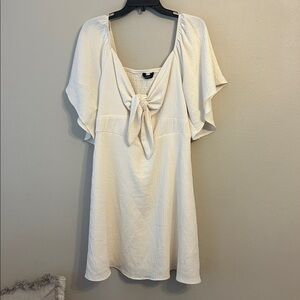 Cream Cocktail dress with tie front New without tags.